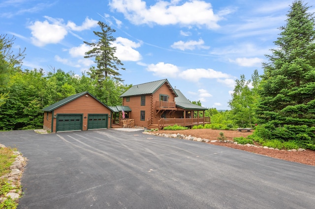 1 Peak Vista Ln, Madison, NH 03849 - view of front of house with a garage and a metal roof