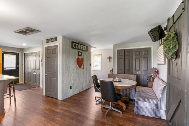 174 E Colebrook Rd, Colebrook, NH 03576 - dining area with dark wood finished floors and a barn door