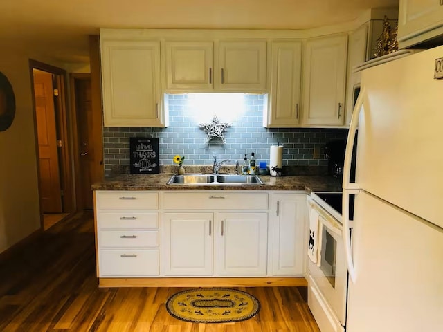 174 E Colebrook Rd, Colebrook, NH 03576 - kitchen featuring freestanding refrigerator, electric range oven, dark wood-style flooring, backsplash, and dark countertops