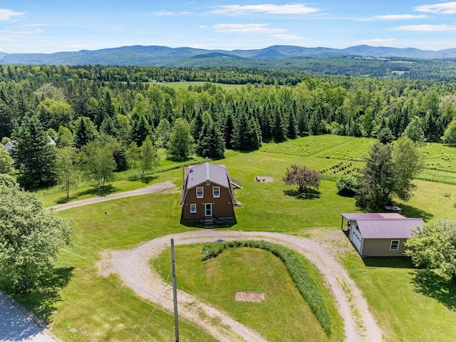 174 E Colebrook Rd, Colebrook, NH 03576 - aerial view of property and surrounding area featuring mountains and a heavily wooded area