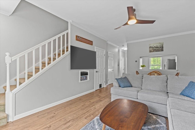 8 Kristen Ct, Williston, VT 05495 - living room with crown molding, stairs, wood finished floors, and a ceiling fan