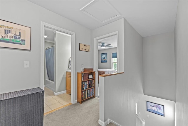 8 Kristen Ct, Williston, VT 05495 - corridor with an upstairs landing, attic access, light tile patterned floors, and light carpet