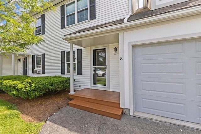 8 Kristen Ct, Williston, VT 05495 - property entrance with a garage and cooling unit