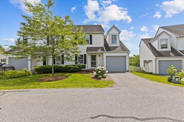 8 Kristen Ct, Williston, VT 05495 - view of front of home with a front yard, a garage, and driveway