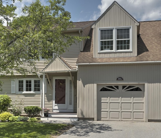 38C Stonehouse Ln, Keene, NH 03431 - view of front facade featuring a shingled roof and asphalt driveway