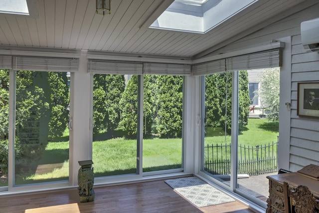 38C Stonehouse Ln, Keene, NH 03431 - unfurnished sunroom with a skylight, lofted ceiling, plenty of natural light, wood finished floors, and a wall mounted air conditioner
