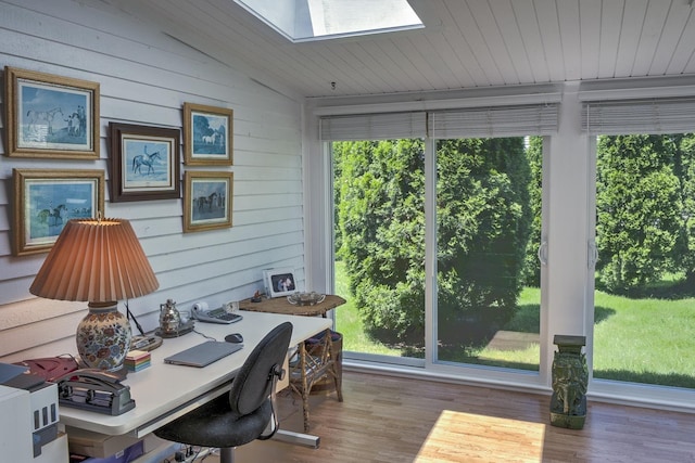 38C Stonehouse Ln, Keene, NH 03431 - home office featuring a skylight, lofted ceiling, healthy amount of natural light, wood finished floors, and wooden walls