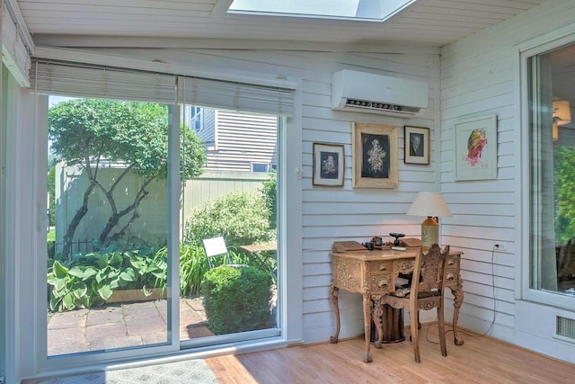 38C Stonehouse Ln, Keene, NH 03431 - doorway featuring a wall unit AC, a skylight, wood finished floors, wood walls, and plenty of natural light