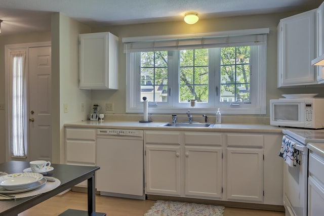38C Stonehouse Ln, Keene, NH 03431 - kitchen with white appliances, white cabinetry, and light countertops