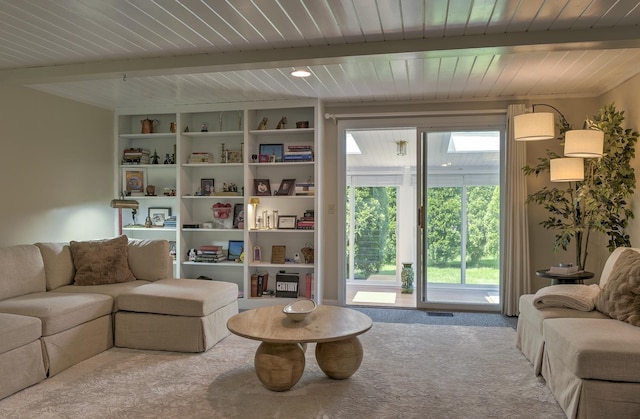 38C Stonehouse Ln, Keene, NH 03431 - living room featuring carpet flooring and a wooden ceiling with exposed beams