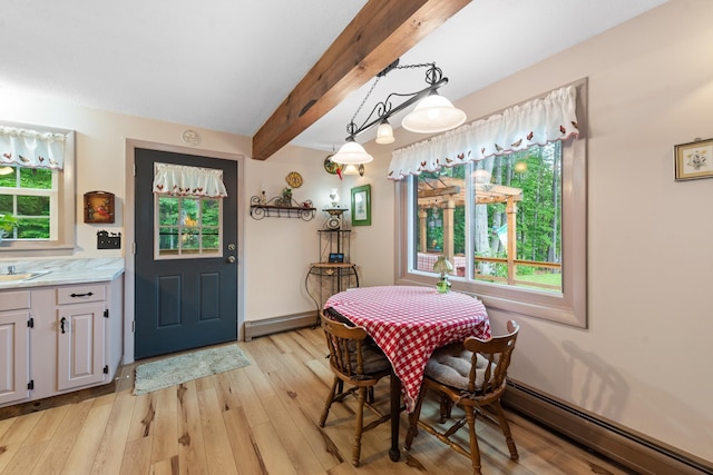 85 Lakeview Ave, Bristol, NH 03222 - dining area with a baseboard radiator, beam ceiling, and light wood-style flooring