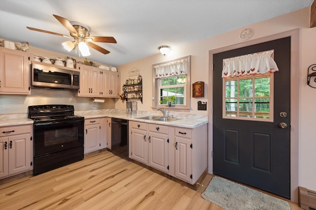 85 Lakeview Ave, Bristol, NH 03222 - kitchen featuring black appliances, light countertops, light wood finished floors, and ceiling fan