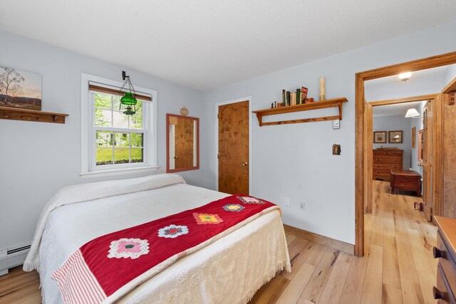 85 Lakeview Ave, Bristol, NH 03222 - bedroom with light wood-style floors and baseboard heating