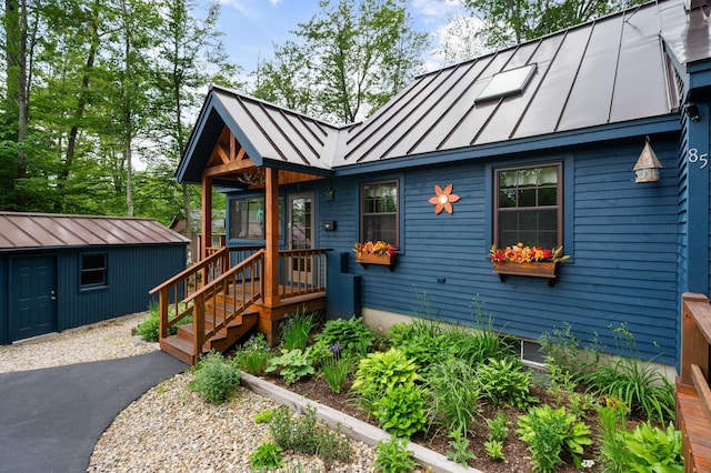 85 Lakeview Ave, Bristol, NH 03222 - view of front of home featuring a standing seam roof, a metal roof, and an outbuilding