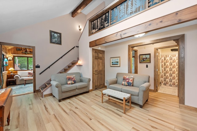 85 Lakeview Ave, Bristol, NH 03222 - living room with wood finished floors, stairs, beam ceiling, and high vaulted ceiling