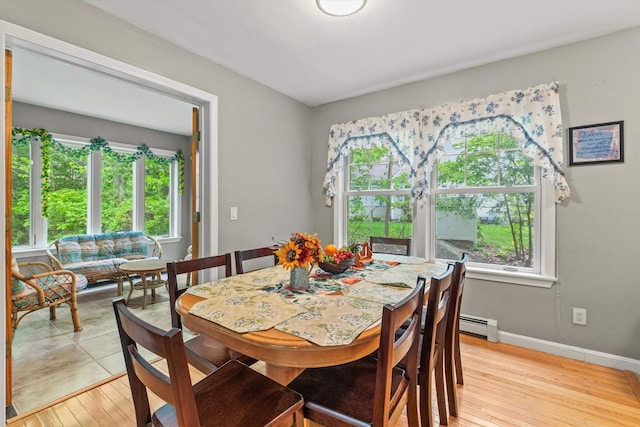 25 Sweetbrier Way, Laconia, NH 03246 - dining area featuring baseboard heating, plenty of natural light, and light wood finished floors