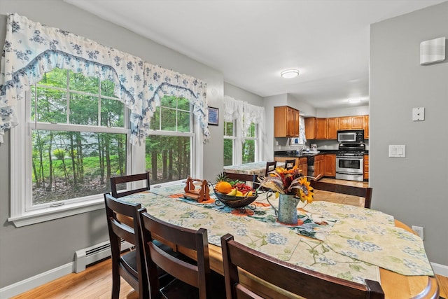 25 Sweetbrier Way, Laconia, NH 03246 - dining room featuring baseboard heating and light wood-type flooring