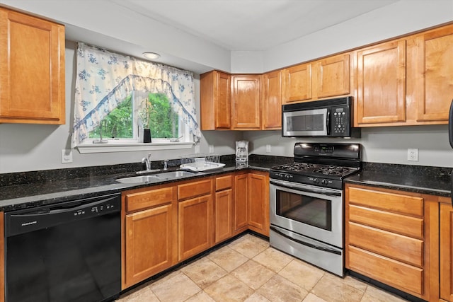 25 Sweetbrier Way, Laconia, NH 03246 - kitchen with black appliances, dark stone counters, and brown cabinets
