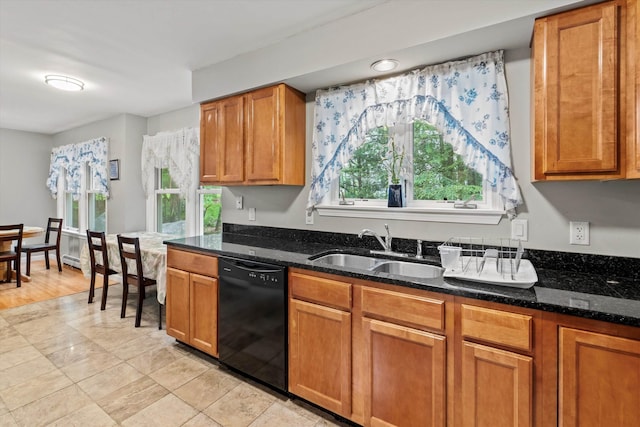 25 Sweetbrier Way, Laconia, NH 03246 - kitchen with black dishwasher, healthy amount of natural light, dark stone countertops, and brown cabinetry
