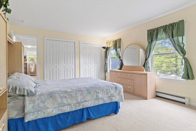 25 Sweetbrier Way, Laconia, NH 03246 - bedroom with a baseboard radiator, multiple closets, and light colored carpet