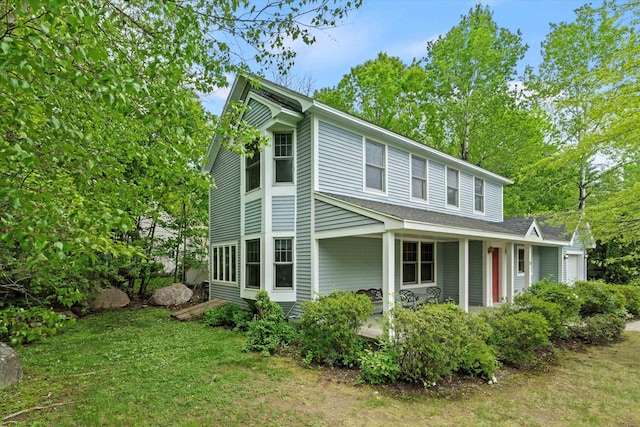 25 Sweetbrier Way, Laconia, NH 03246 - view of side of home with a porch, a lawn, and a shingled roof