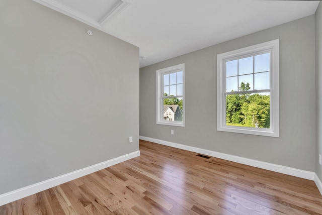 36 Laperle Dr, Rochester, NH 03867 - unfurnished room featuring light wood-style flooring and attic access