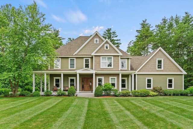 10 Benjamins Way, Hollis, NH 03049 - view of front of house featuring covered porch, a front lawn, and a shingled roof