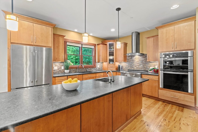 10 Benjamins Way, Hollis, NH 03049 - kitchen featuring appliances with stainless steel finishes, wall chimney exhaust hood, dark countertops, tasteful backsplash, and recessed lighting