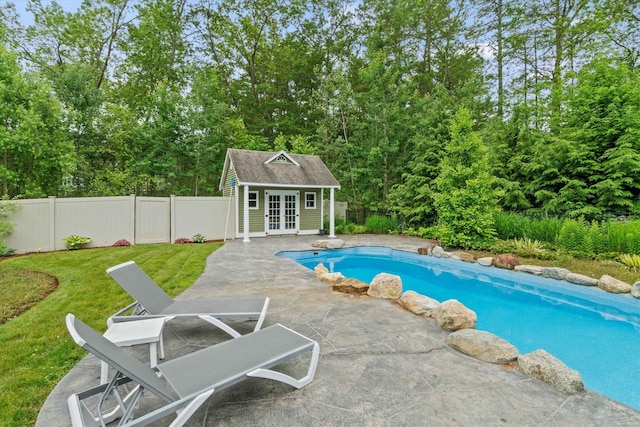 10 Benjamins Way, Hollis, NH 03049 - view of swimming pool featuring french doors, an exterior structure, a patio area, an outdoor structure, and a fenced backyard