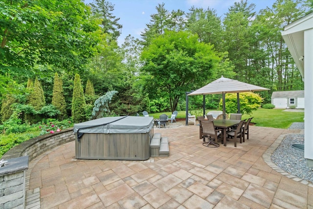 10 Benjamins Way, Hollis, NH 03049 - view of patio / terrace featuring a hot tub, outdoor dining area, an outbuilding, and view of scattered trees