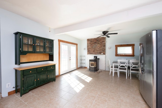 24 Church St, Wakefield, NH 03872 - living area featuring a wood stove, light tile patterned floors, french doors, and a ceiling fan