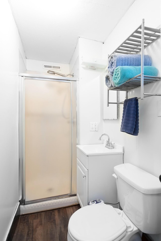 24 Church St, Wakefield, NH 03872 - bathroom featuring a shower stall, wood finished floors, and vanity
