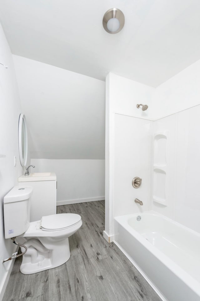 24 Church St, Wakefield, NH 03872 - bathroom with wood finished floors, bathing tub / shower combination, and vaulted ceiling