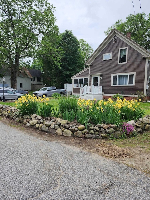 24 Church St, Wakefield, NH 03872 - view of front facade with a chimney