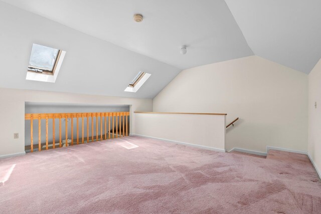 1465 Hooksett Rd Unit 209, Hooksett, NH 03106 - additional living space featuring a skylight, vaulted ceiling, and carpet floors