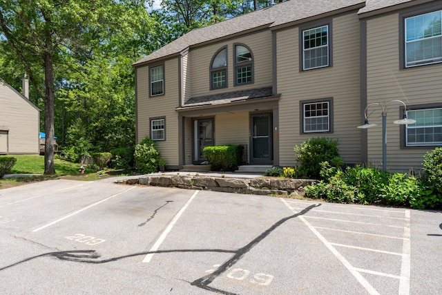 1465 Hooksett Rd Unit 209, Hooksett, NH 03106 - view of front of property featuring uncovered parking and roof with shingles