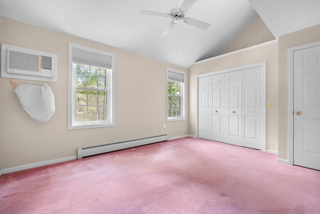 1465 Hooksett Rd Unit 209, Hooksett, NH 03106 - unfurnished bedroom with a baseboard heating unit, carpet floors, a wall mounted air conditioner, vaulted ceiling, and a closet