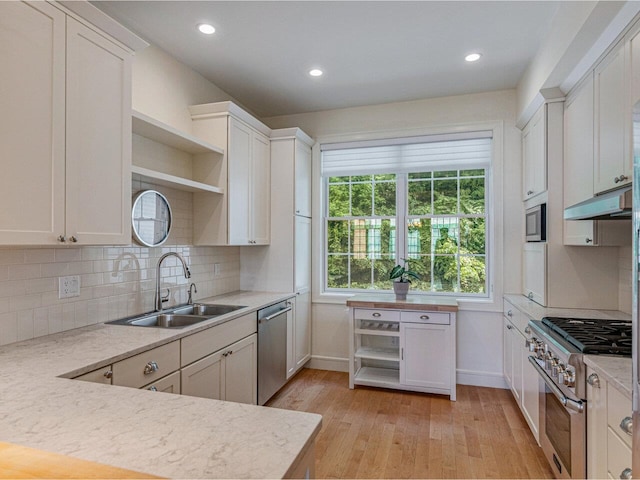 200 Lake St Unit 10, Burlington, VT 05401 - kitchen featuring appliances with stainless steel finishes, open shelves, light wood-style flooring, light countertops, and recessed lighting