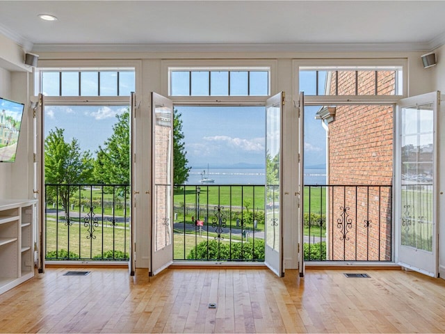 200 Lake St Unit 10, Burlington, VT 05401 - entryway featuring crown molding, a water view, and wood-type flooring