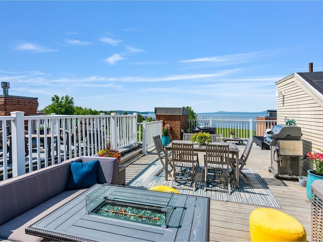 200 Lake St Unit 10, Burlington, VT 05401 - deck featuring area for grilling, outdoor dining area, and an outdoor fire pit