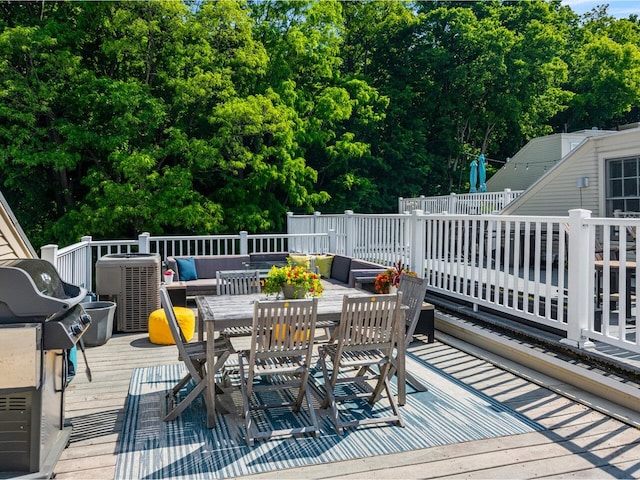 200 Lake St Unit 10, Burlington, VT 05401 - wooden deck featuring area for grilling, outdoor dining space, and view of scattered trees