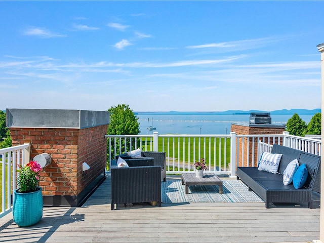 200 Lake St Unit 10, Burlington, VT 05401 - wooden terrace featuring outdoor lounge area, a water view, and a yard