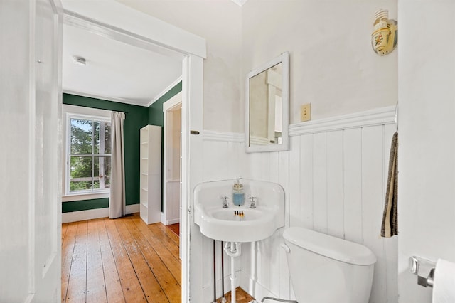 91 Robert Ln, Plainfield, VT 05667 - half bath featuring hardwood / wood-style flooring, wainscoting, and ornamental molding