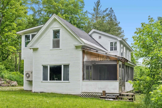 91 Robert Ln, Plainfield, VT 05667 - back of property with a sunroom and a yard