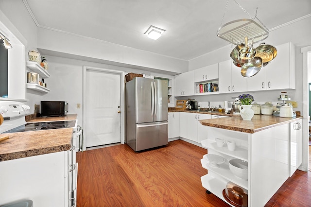 91 Robert Ln, Plainfield, VT 05667 - kitchen with open shelves, freestanding refrigerator, white electric range oven, black microwave, and ornamental molding