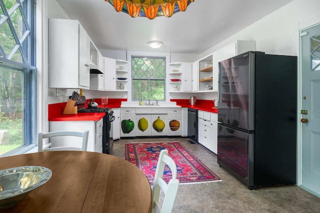 4 Fairbourne Ln, York, ME 03902 - kitchen featuring freestanding refrigerator, gas stove, open shelves, and white cabinets