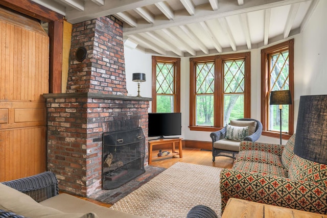 4 Fairbourne Ln, York, ME 03902 - living room featuring plenty of natural light, wood finished floors, and a brick fireplace