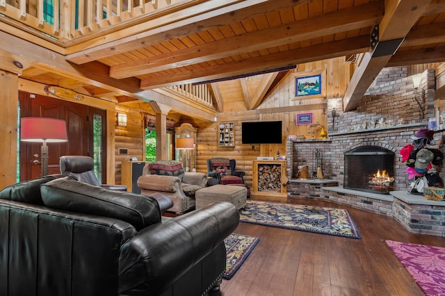 7 Reidy Way, Littleton, NH 03561 - living room with decorative columns, hardwood / wood-style floors, a brick fireplace, rustic walls, and wood ceiling