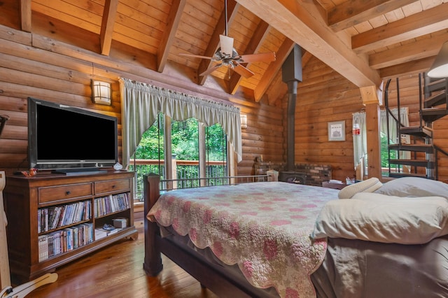 7 Reidy Way, Littleton, NH 03561 - bedroom with wood ceiling, hardwood / wood-style floors, a wood stove, and access to exterior
