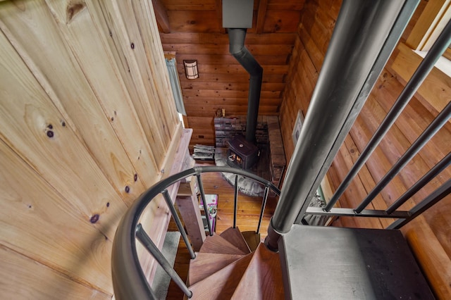 7 Reidy Way, Littleton, NH 03561 - staircase featuring wood walls and a wood stove